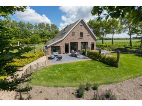 Very luxurious holiday home in beautiful Zeeland style suitable for 7 people